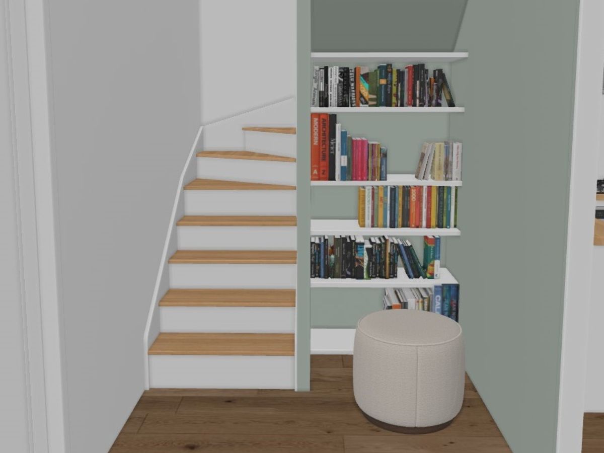 Bibliothèque sur mesure sous escalier Bibliothèque sous un escalier avec mur vert sauge - consultante en aménagement intérieur en gironde